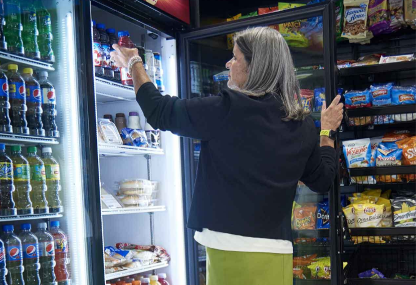 Woman getting a bottle of drink